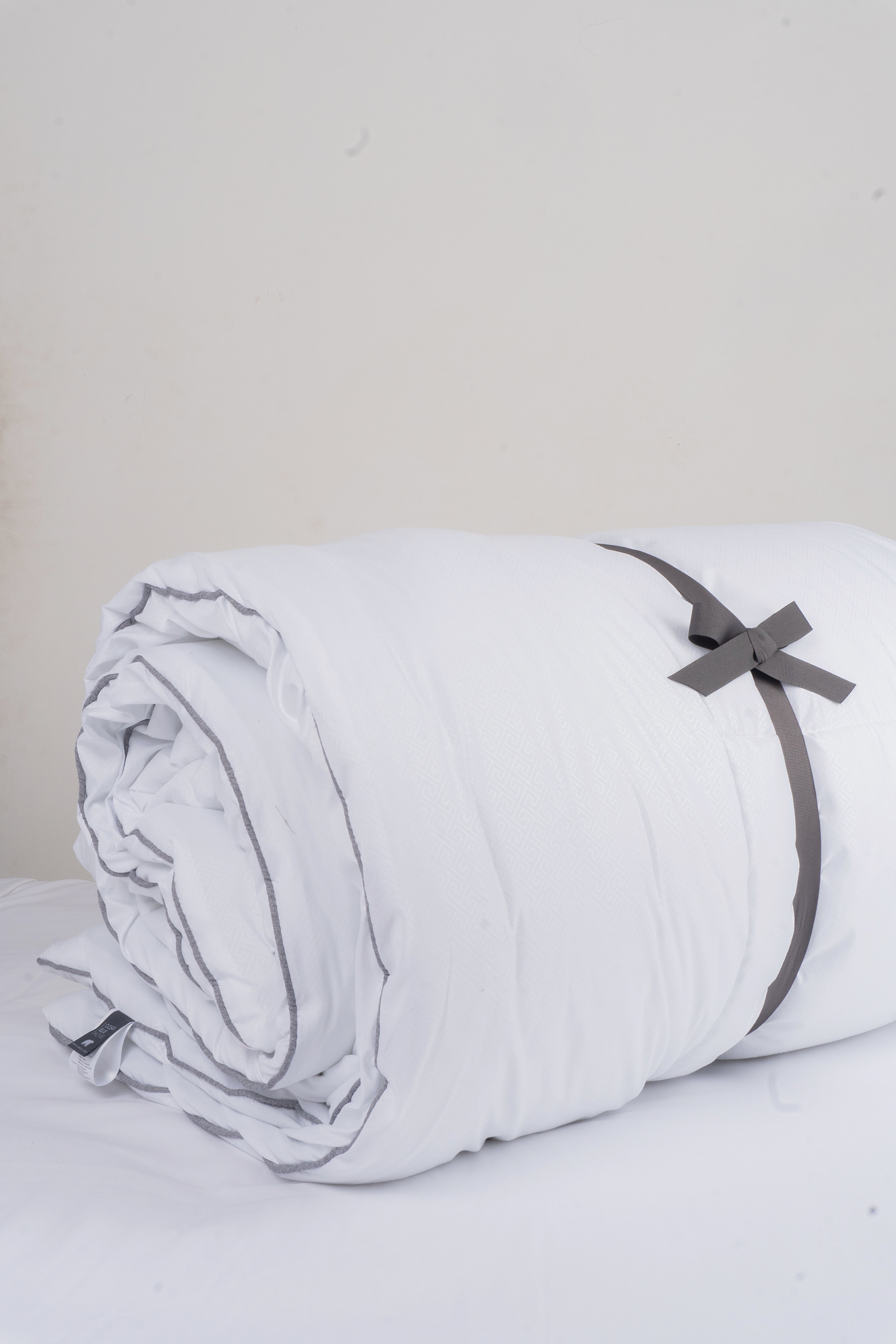 Cozy Montecarlo duvet insert with a lightweight, warm design and grid stitching to keep the eco-feather filling in place.