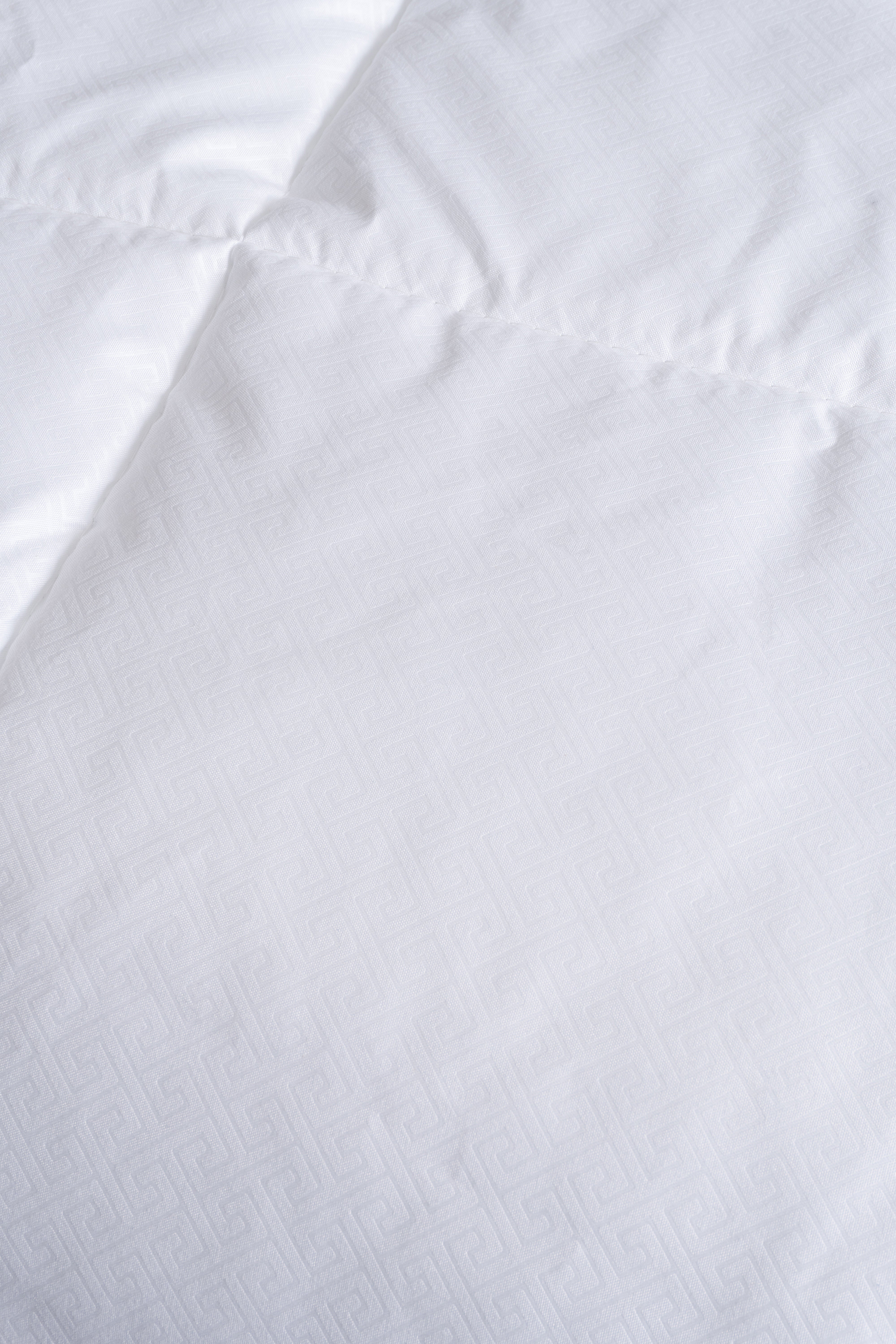 Cozy Montecarlo duvet insert with a soft, lightweight design and quilted vertical and horizontal stitching for even warmth.
