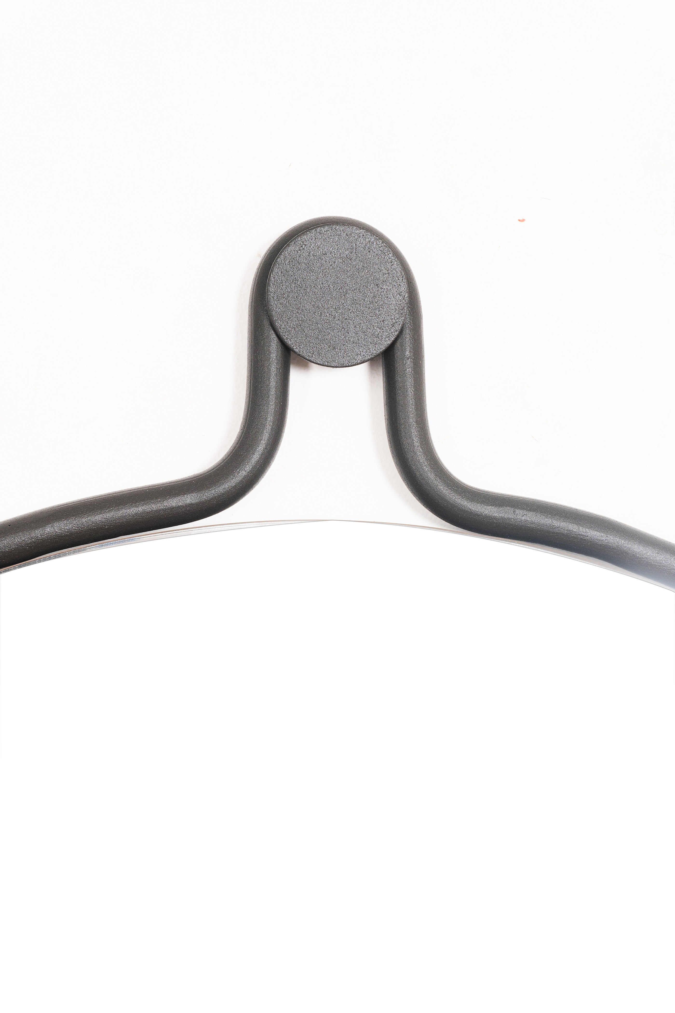 Elegant round Brussels Mirror with a unique drop-shaped design, featuring a steel frame and natural leather strap.