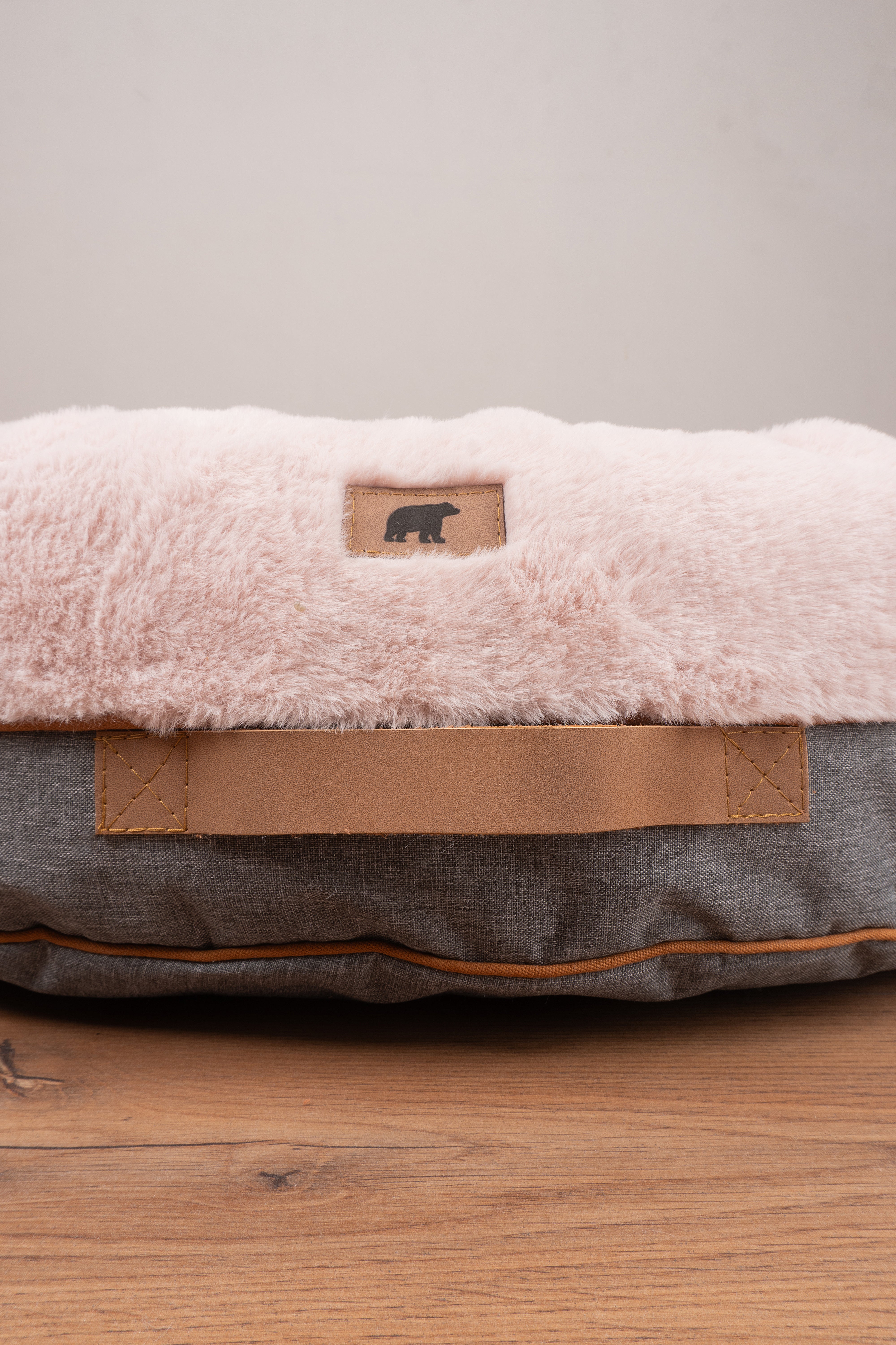 Cozy pink Pouf Pets Paco Palo Rosa pet bed with a soft, furry texture and non-slip base, perfect for pets to relax in comfort.