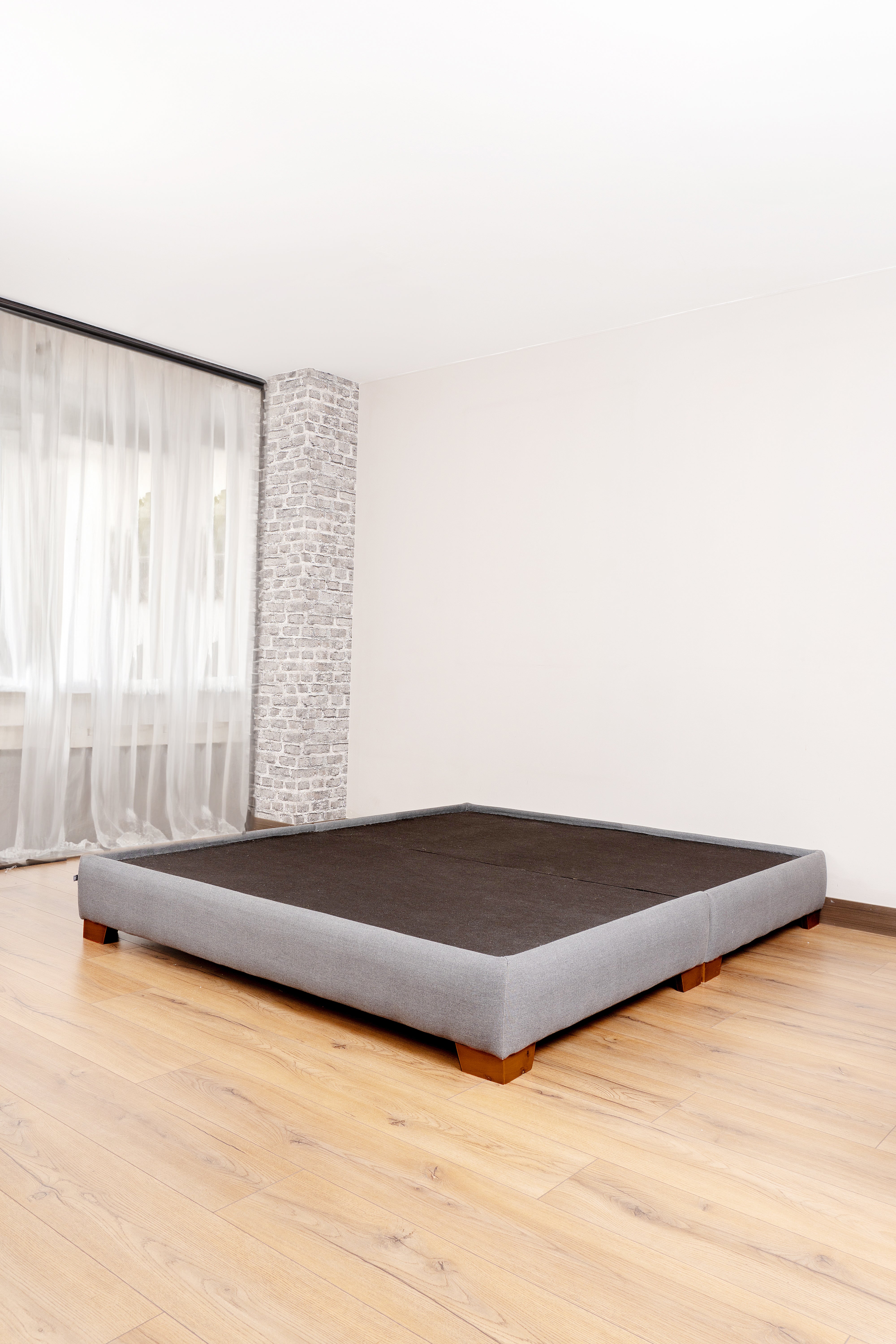 Elegant Venecia Bed Base with a sleek, canvas-upholstered frame in neutral tones, perfect for stylish bedroom decor.